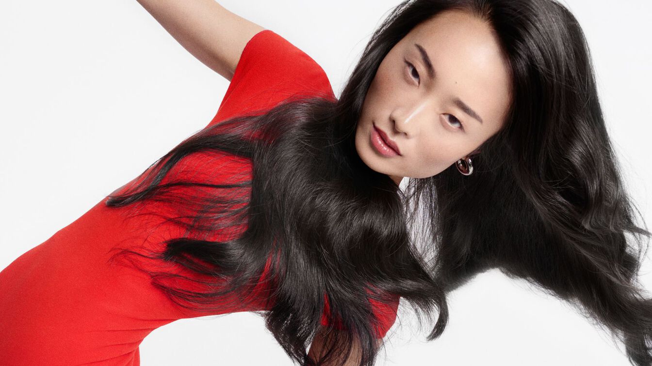 Woman with long healthy brunette hair — Kérastase professional hair care guide by WOOP Cyprus