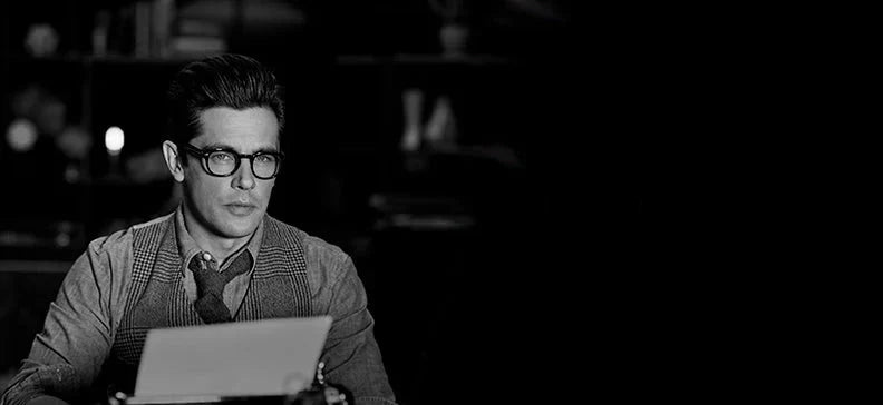 B&W image of a male model styled using American Crew grooming products, available at WOOP in Cyprus
